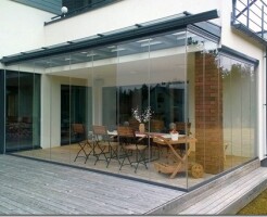 Стеклянные веранды для дома: виды конструкций и особенности остекления